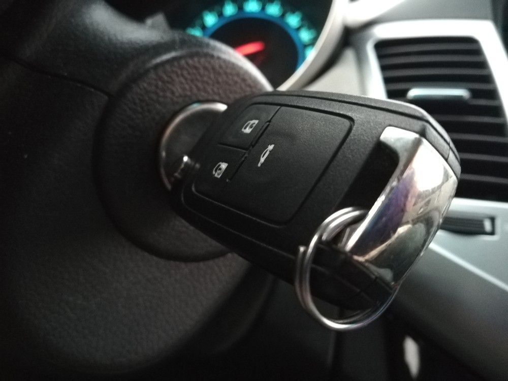 A Car Key is Sitting on the Steering Wheel of a Car — Suresafe Locksmiths in Glenvale, QLD