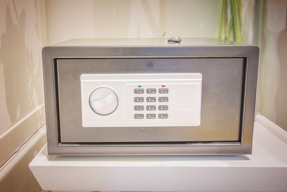 A Stainless Steel Safe is Sitting on Top of a White Table — Suresafe Locksmiths in Glenvale, QLD