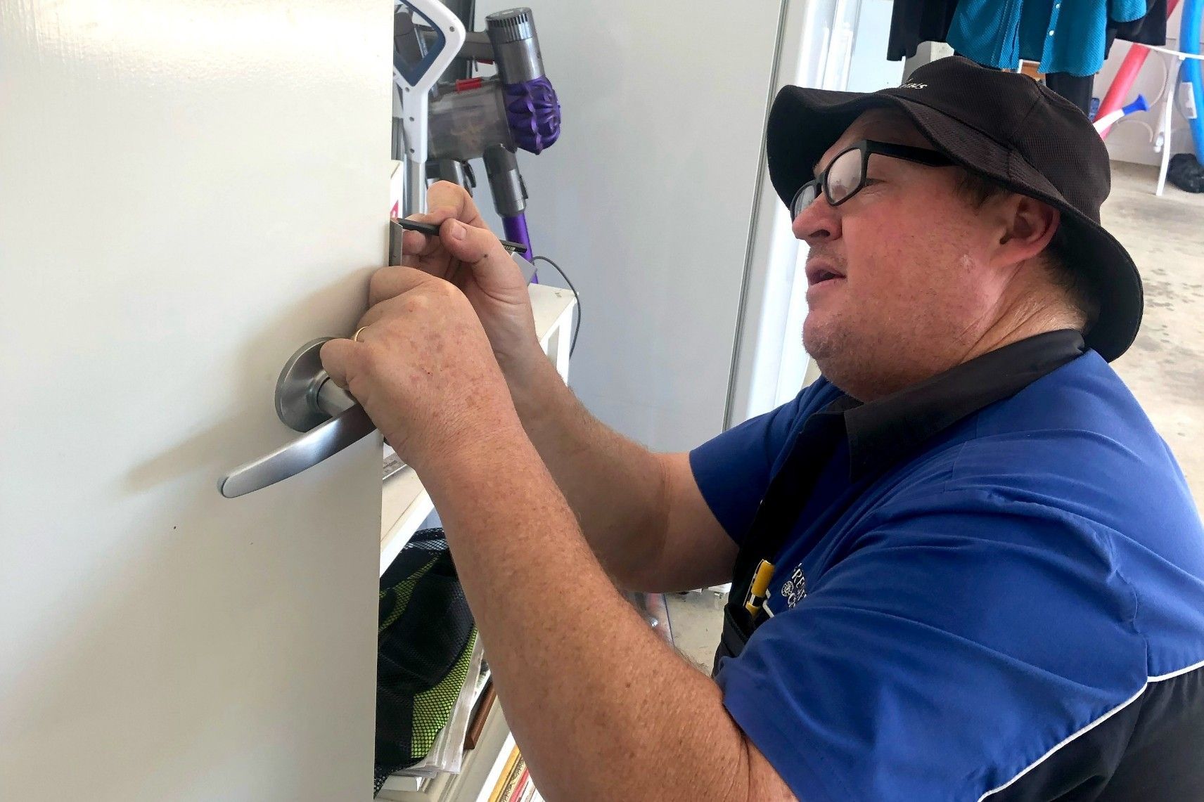 A Man Opening The Door Lock