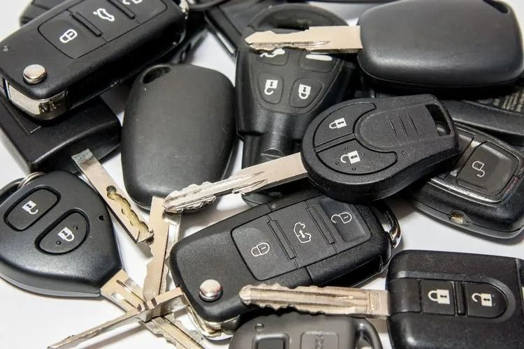 A Bunch of Car Keys Are Stacked on Top of Each Other — Suresafe Locksmiths in Glenvale, QLD