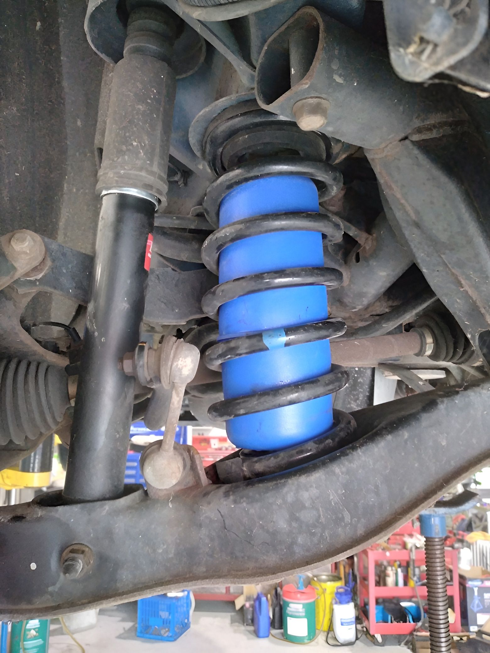 Blue Air Spring Installed in a Car's Suspension System — Assassin Automotive Solutions in South Murwillumbah, NSW