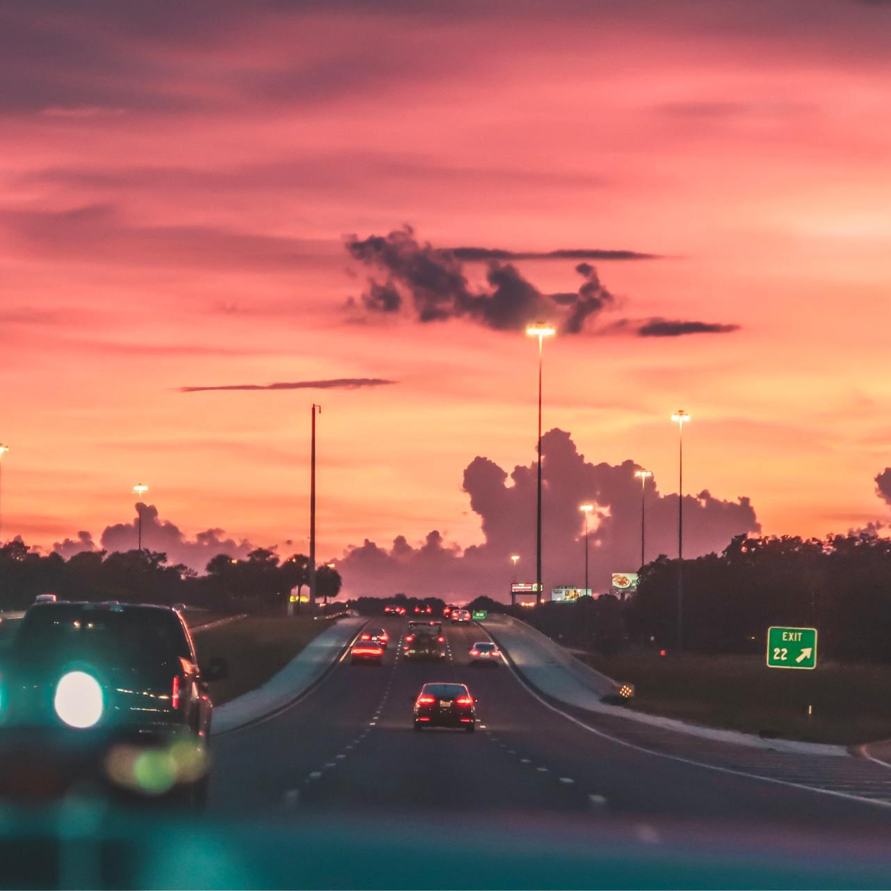cars on a highway at dusk