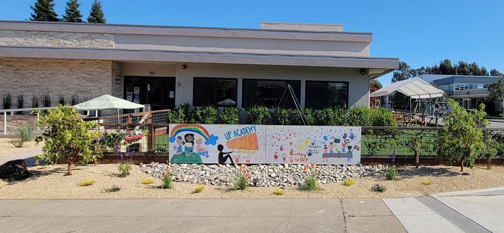 A large building with a mural on the side of it.