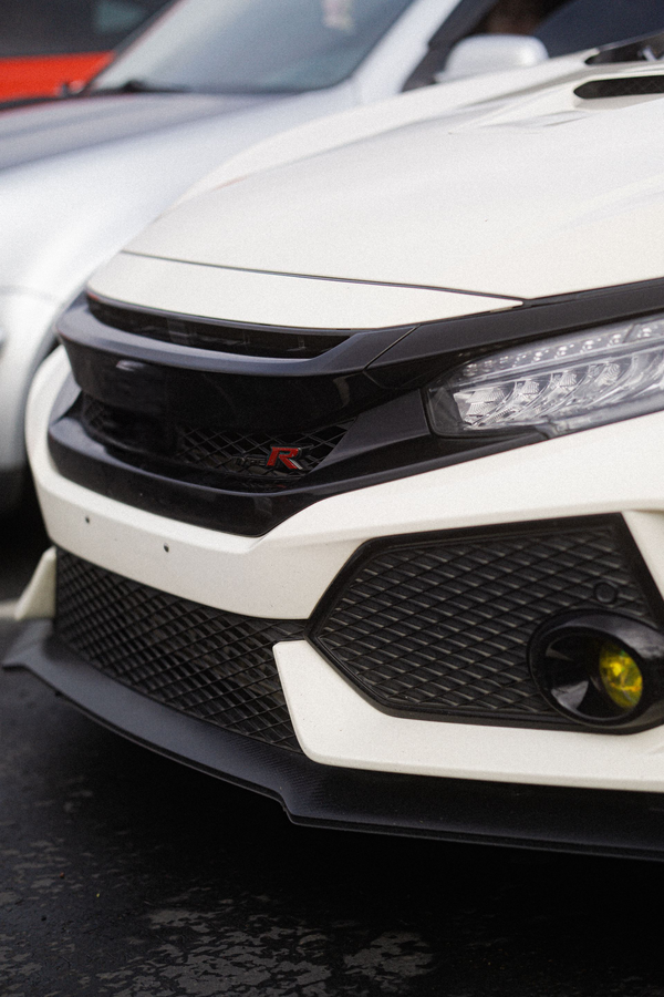 A white honda civic type r is parked in a parking lot. | Oswald Service Inc