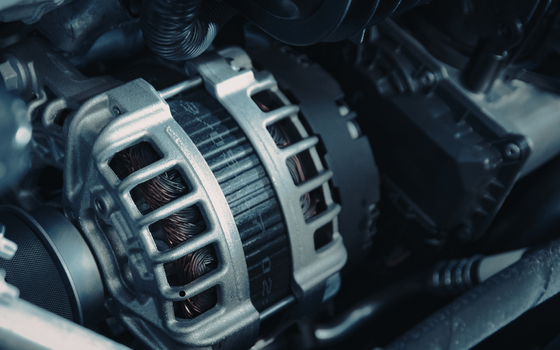 a roadside mechanic removing a car rim