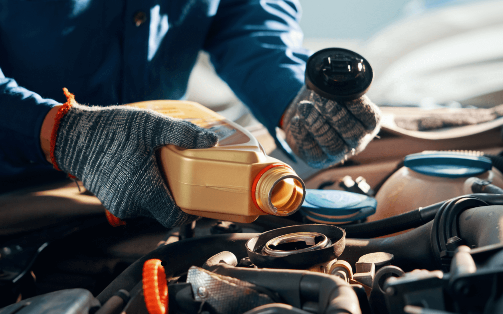 a mechanic doing a pre-purchase inspection on a white car with white interior seats