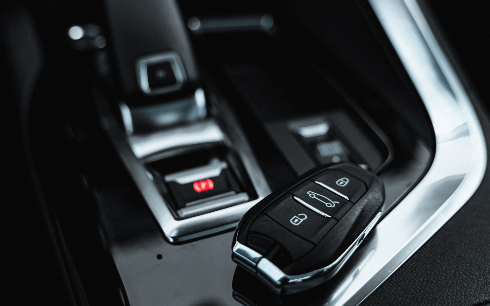 a mechanic doing a pre-purchase inspection on a white car with white interior seats