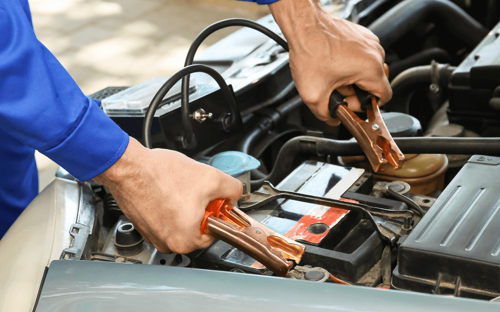a mechanic doing a pre-purchase inspection on a white car with white interior seats