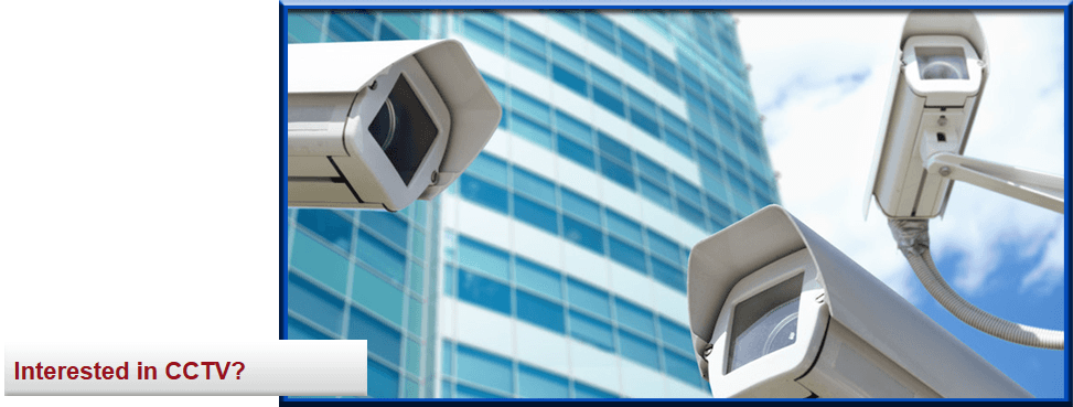 3 cctv cameras in front of a building