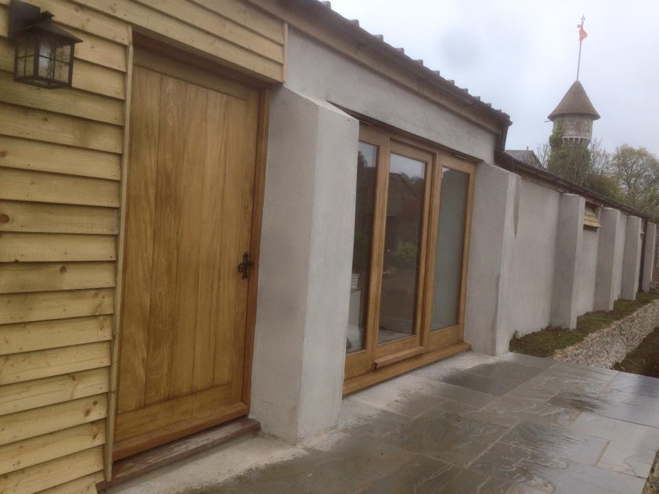 wooden doors and windows installed in front of home