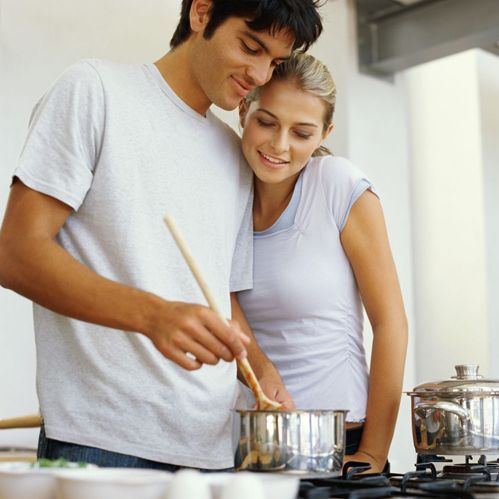 Couple cooking on a stove installed by propane experts in Ashland, NE