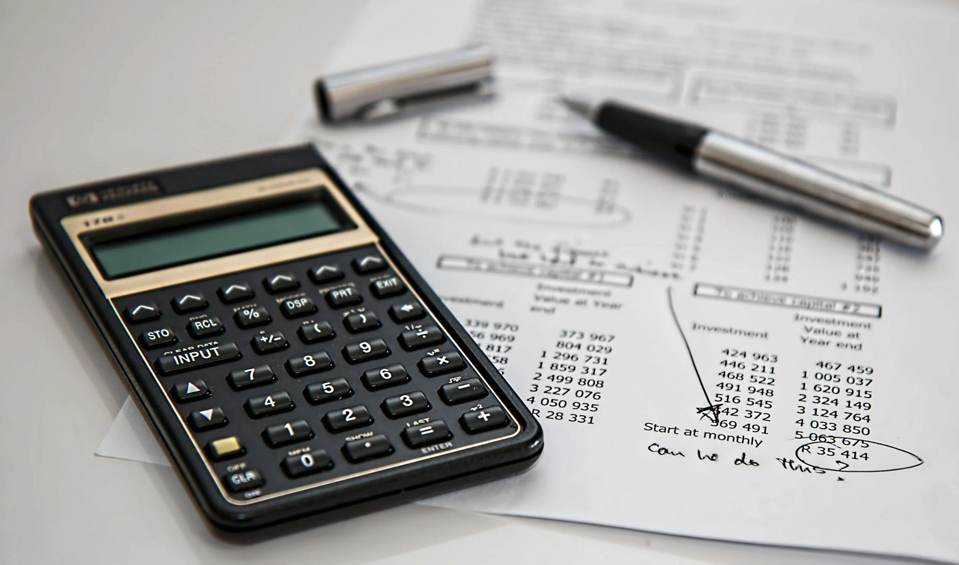 A calculator with icons for security equipment, installation, and monthly fees