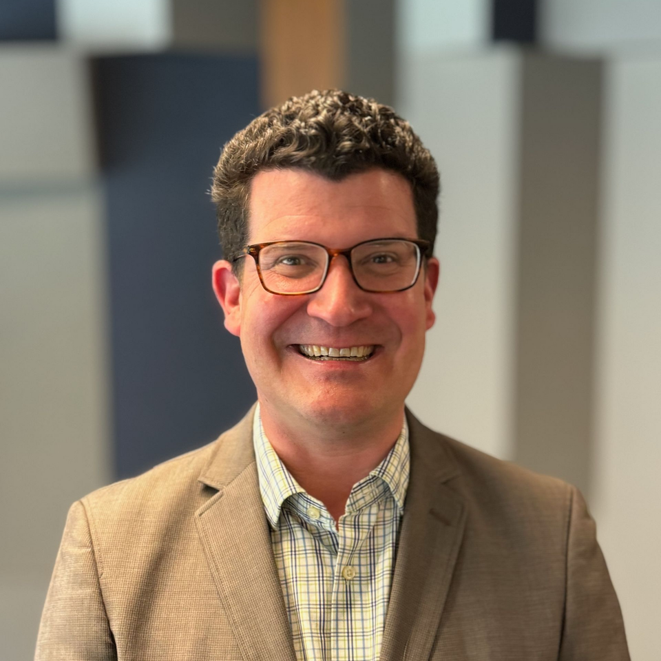 Kemp Mullaney, SaaS Partnerships expert, in business casual clothes, at an industry event held at LinkedIn's San Fransisco office.