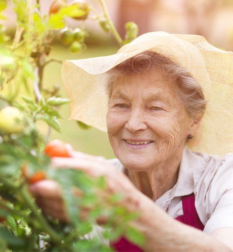 Senior Woman in Her Garden — Glenview, IL — Bethany Methodist