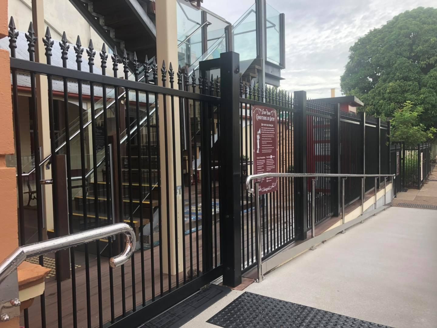 Black Wrought Iron Fence With a Staircase in the Background — Lange's Fencing and Landscaping Centre in Island Plantation, QLD