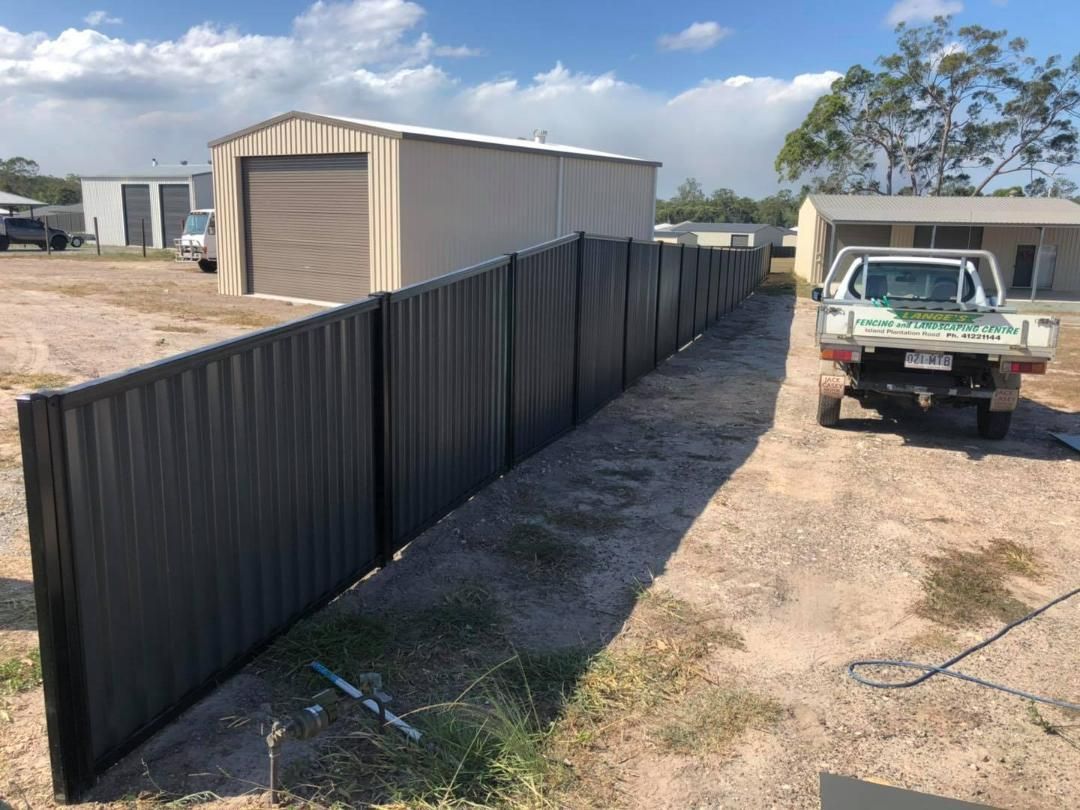 Truck is Parked Next to a Fence in a Dirt Field — Lange's Fencing and Landscaping Centre in Island Plantation, QLD