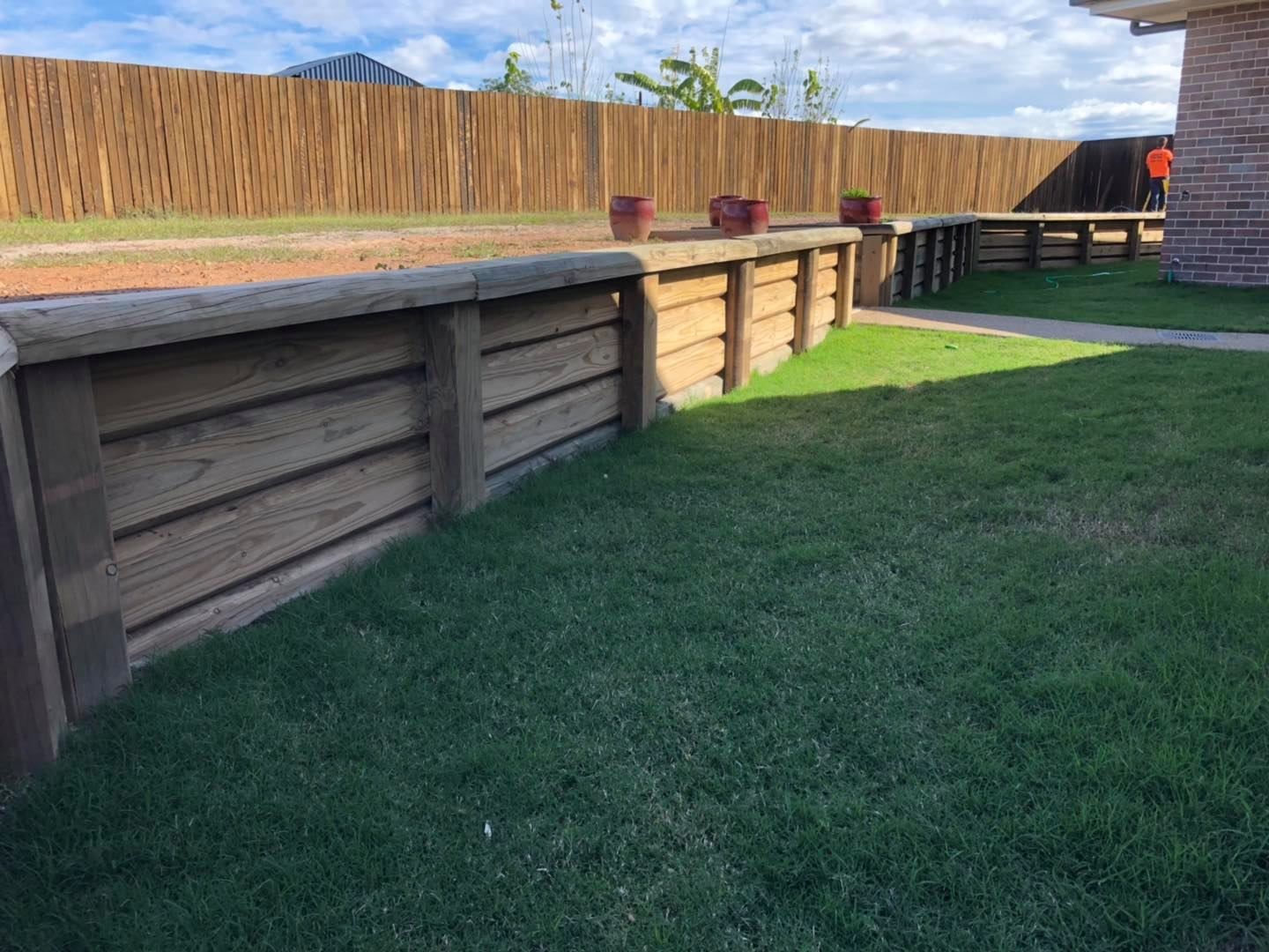 House With a Fence and a Carport in Front of It — Lange's Fencing and Landscaping Centre in Maryborough, QLD
