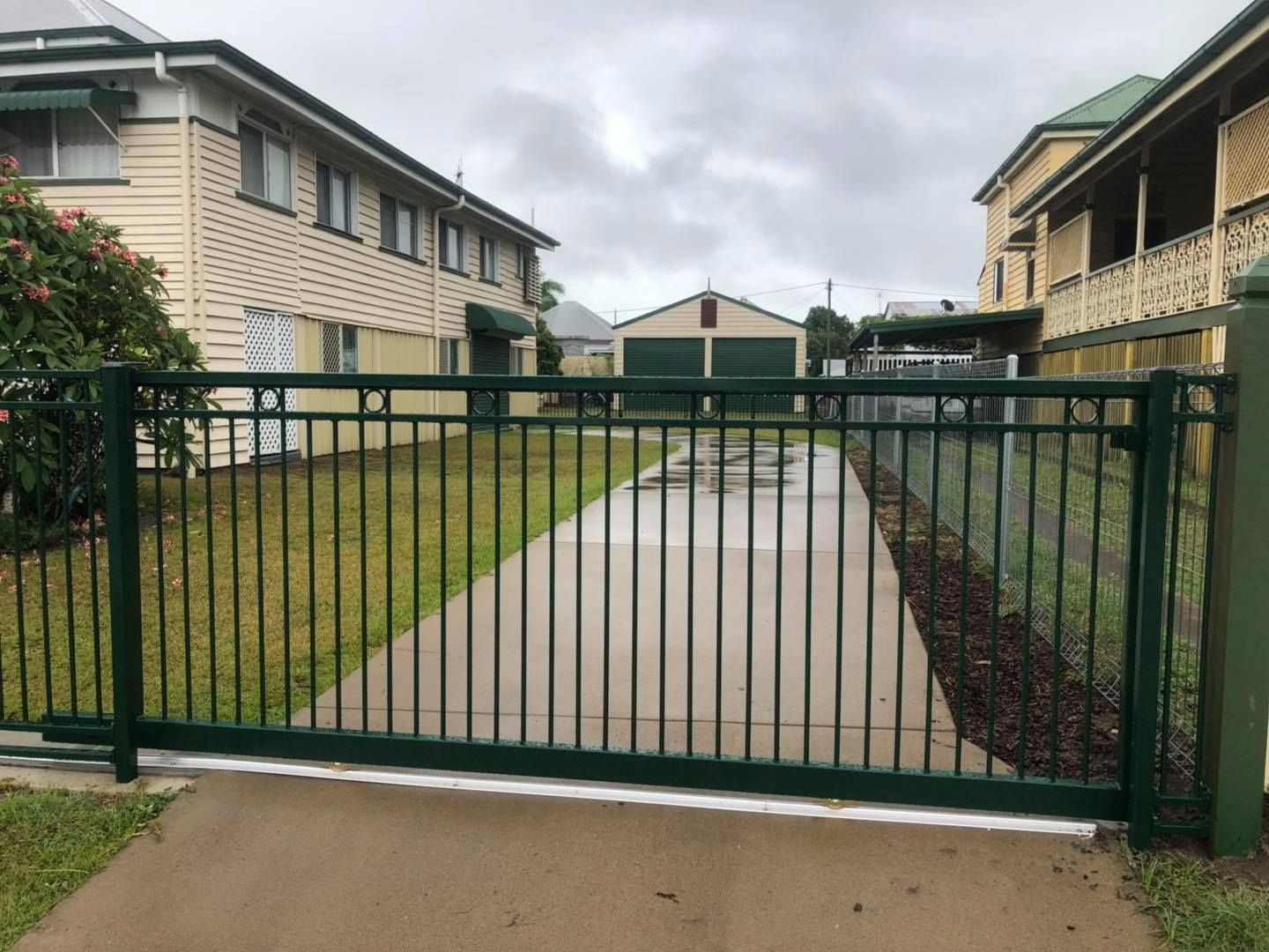 Black Gate in front of driveway — Lange's Fencing and Landscaping Centre in Island Plantation, QLD