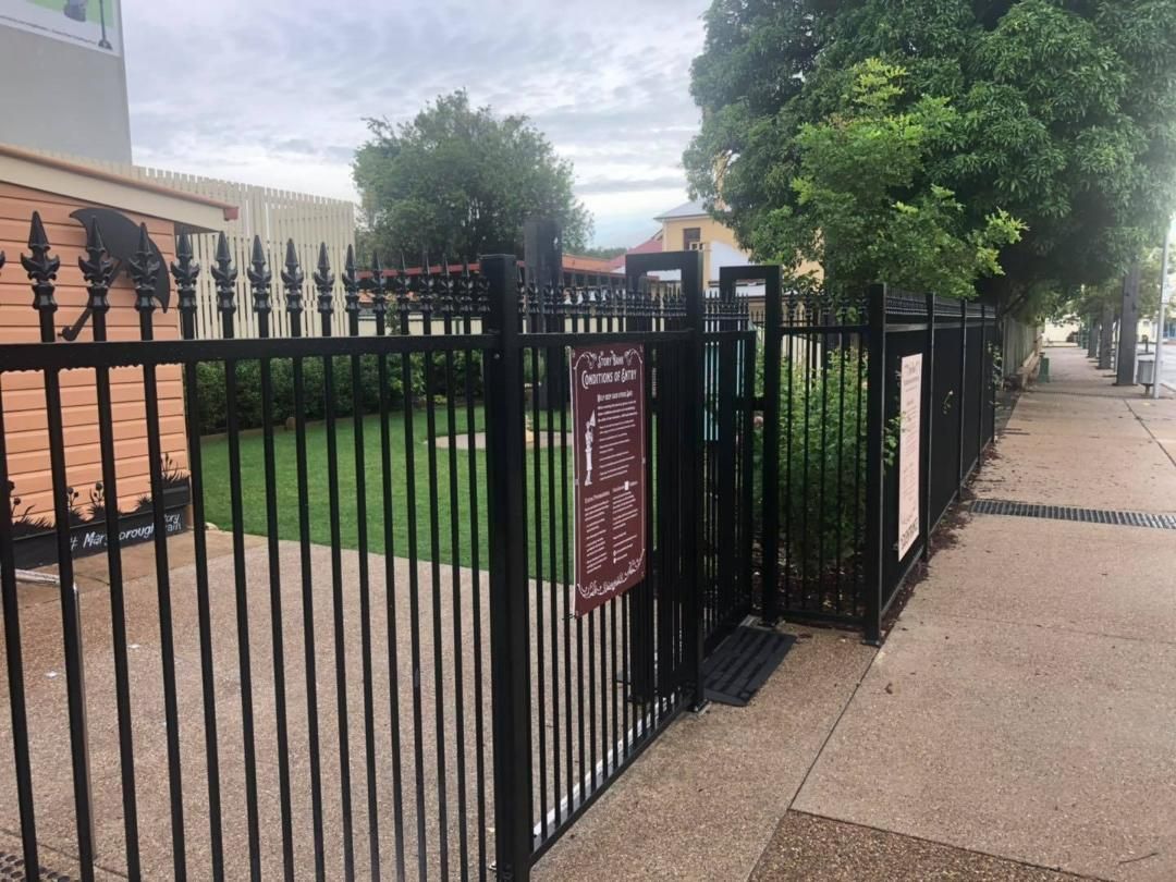 Black Fence With a Sign on It That Says No Dogs Allowed — Lange's Fencing and Landscaping Centre in Hervey Bay, QLD