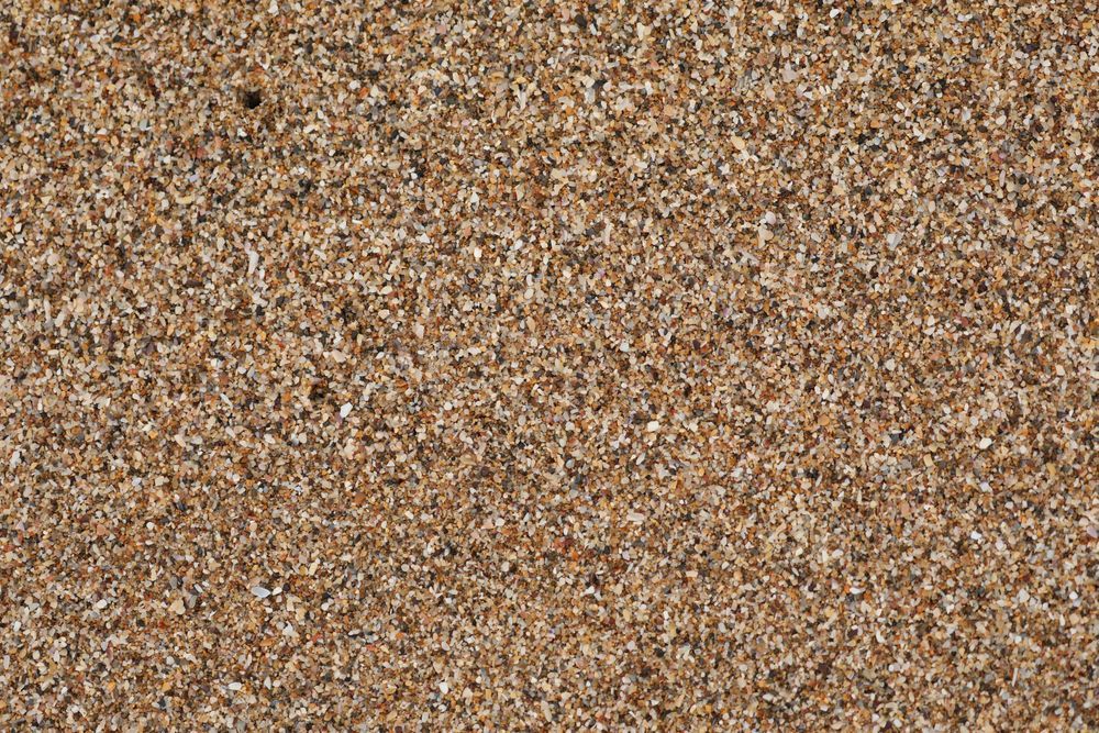 Gravel Driveway Leading to a Fence With Trees in the Background — Lange's Fencing and Landscaping Centre in Island Plantation, QLD