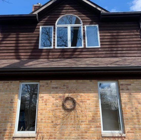 A house with a wreath on the side of it
