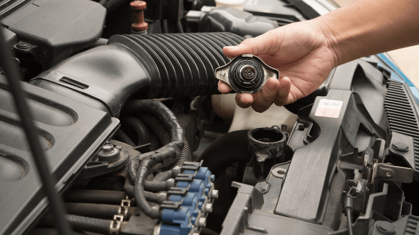 a mechanic changing radiator fluid