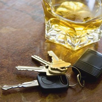 Illegal Driving — Car Keys and a Glass of Alcohol Drink in Savannah, GA