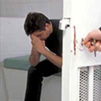 Jail — Person Being Locked Up in a Jail in Savannah, GA