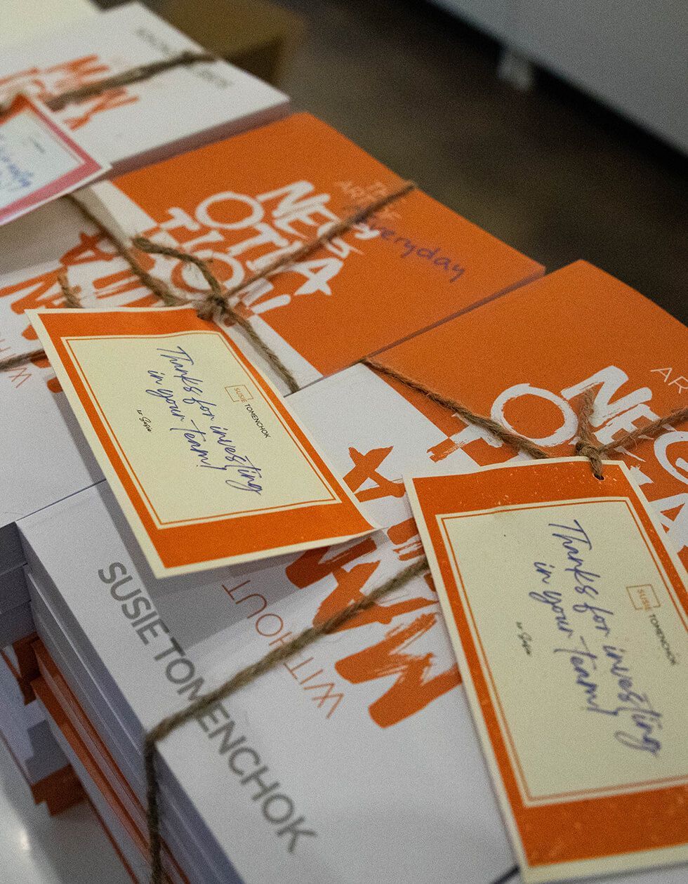 A stack of cards with one that says 