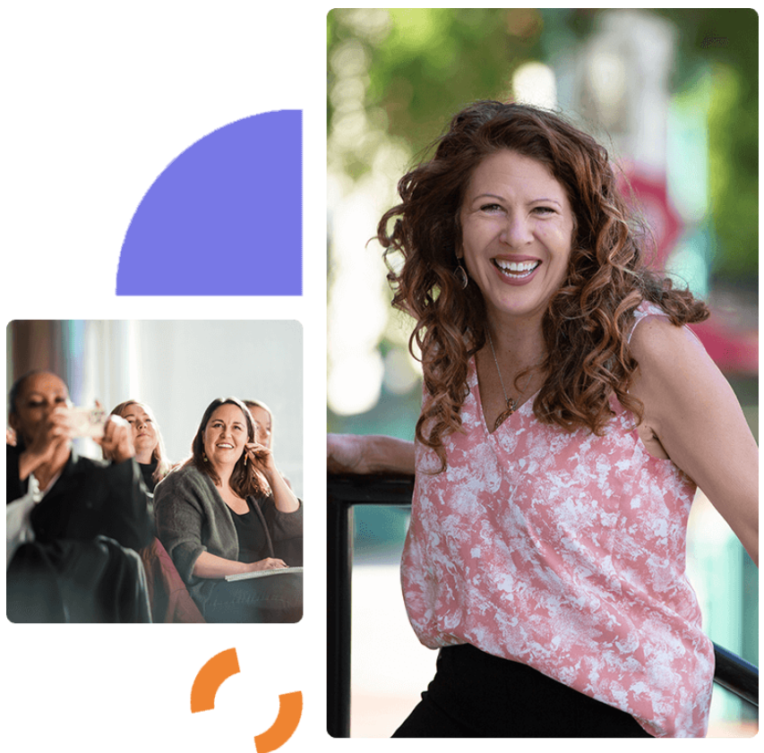 A woman in a pink shirt is smiling in front of a group of people.