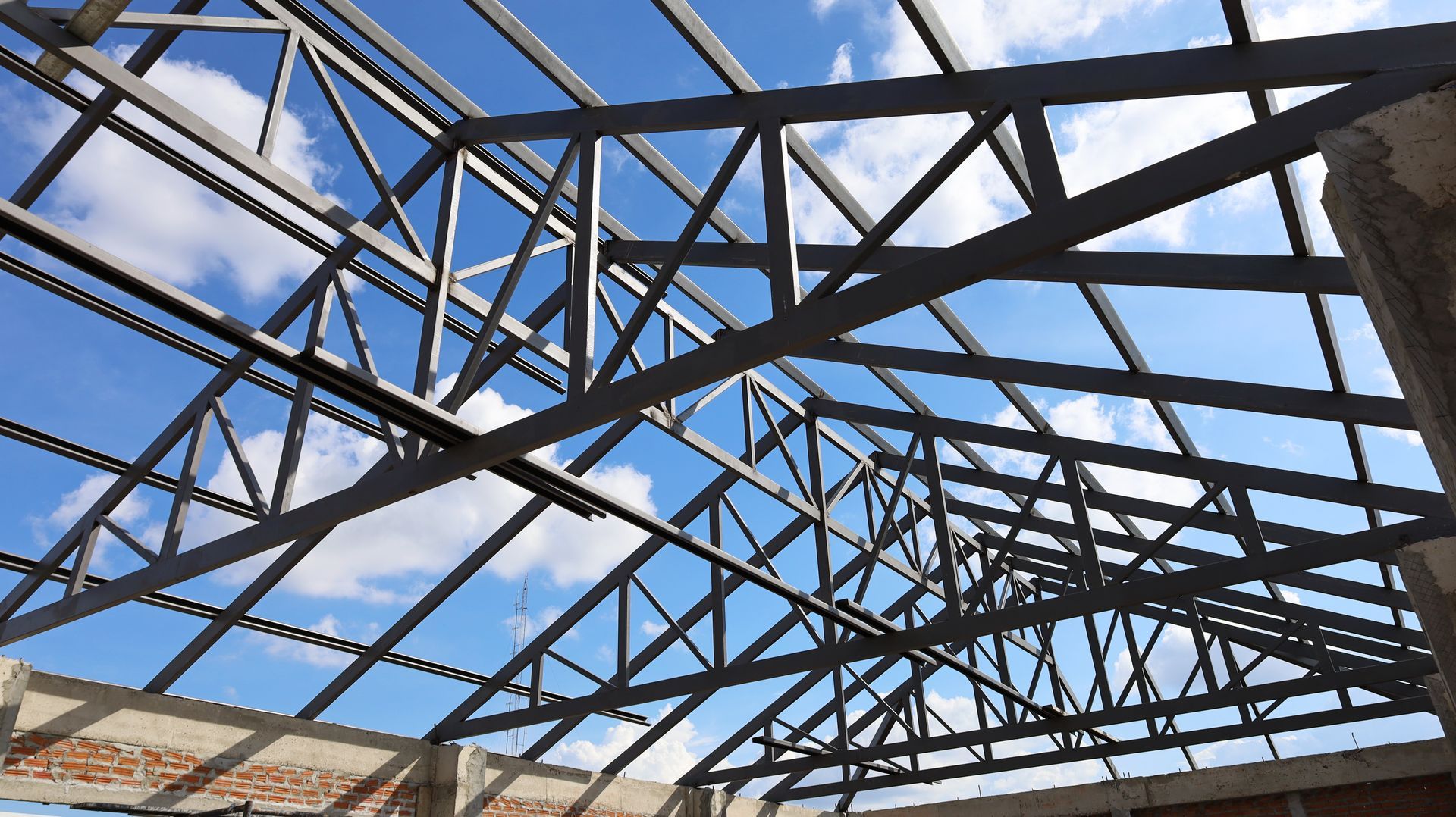 Looking up at the roof of a building under construction