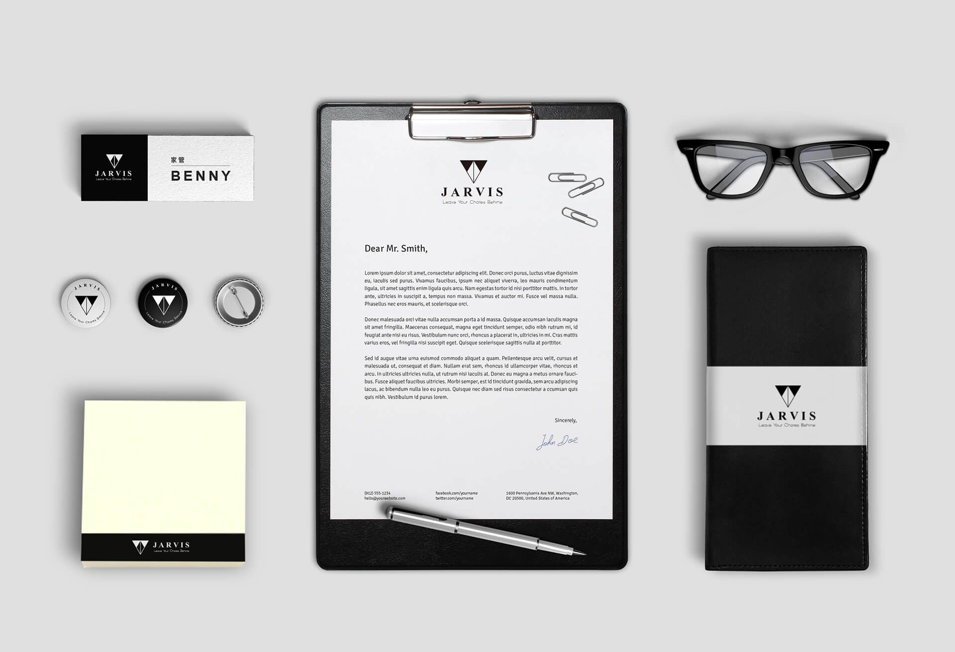 A clipboard with a letter on it next to a pen and glasses.