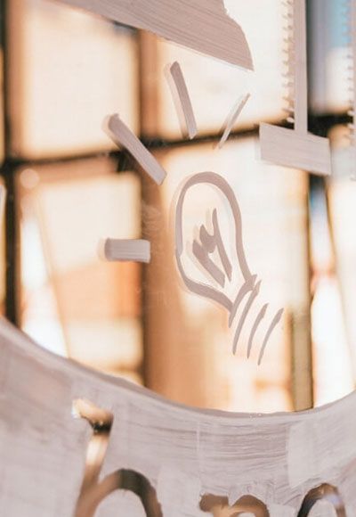 A close up of a clock with a light bulb on it