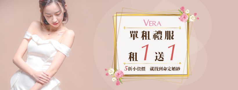 A woman in a white dress is standing next to a sign.