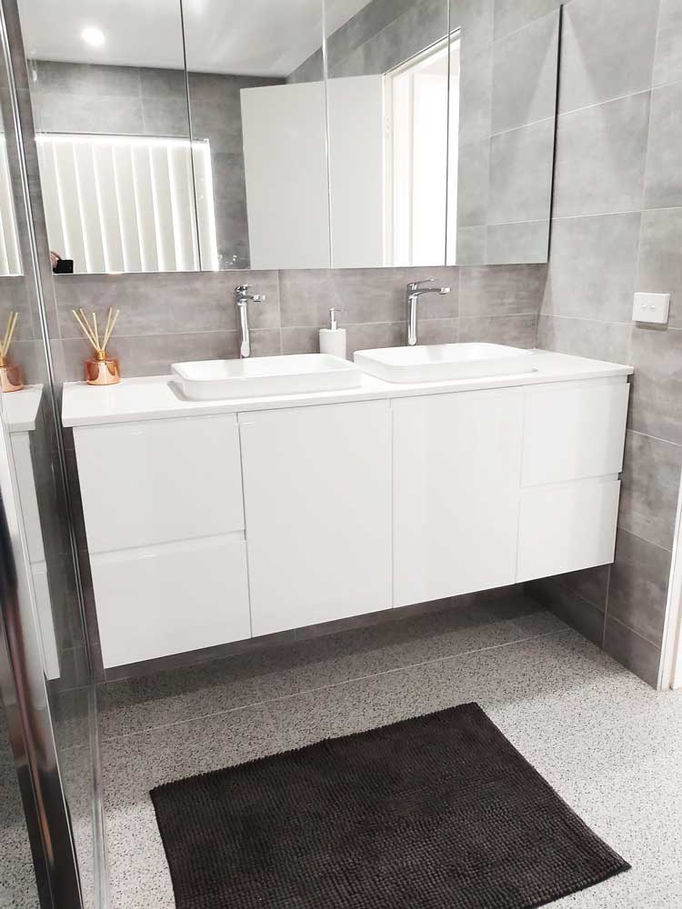 Bathroom Renovation in Melbourne with white vanity and shaving cabinet