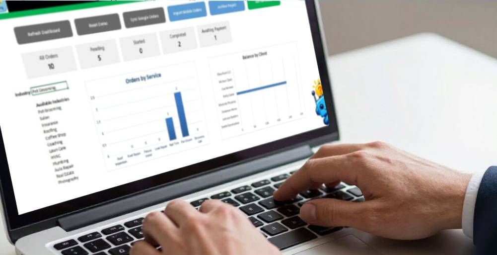 A person uses a laptop displaying a business dashboard with charts and data on orders and service status.