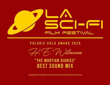 Yellow lettering against a reddish-brown background depicting the L.A. Film Festival Polaris Gold Award 2020 The Martian Diaries, H E Wilburson Best Sound Mix