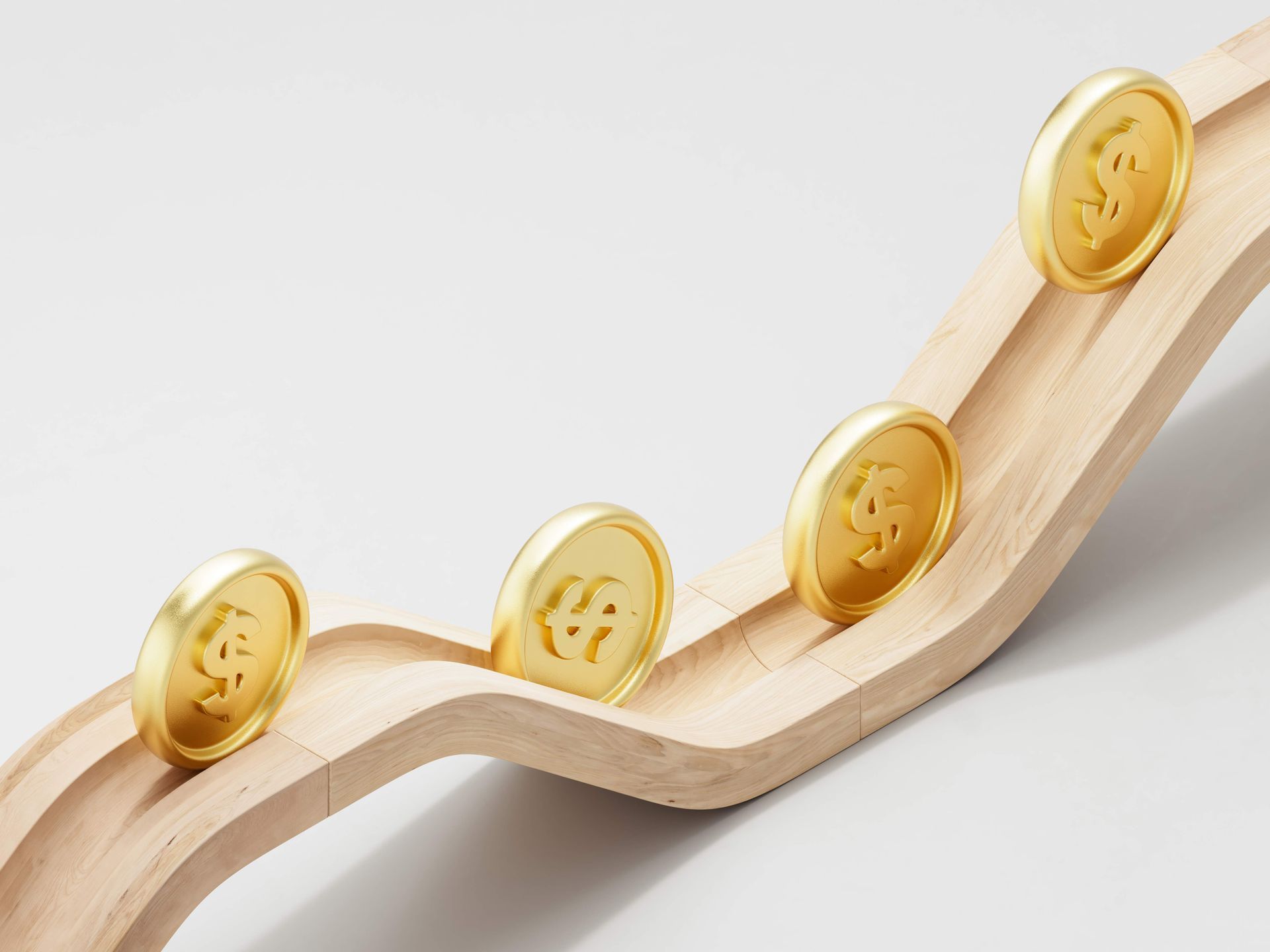 Gold coins with dollar signs rolling down a wooden track, symbolizing loan movement. Gold coins with dollar signs rolling down a wooden track, symbolizing loan movement.