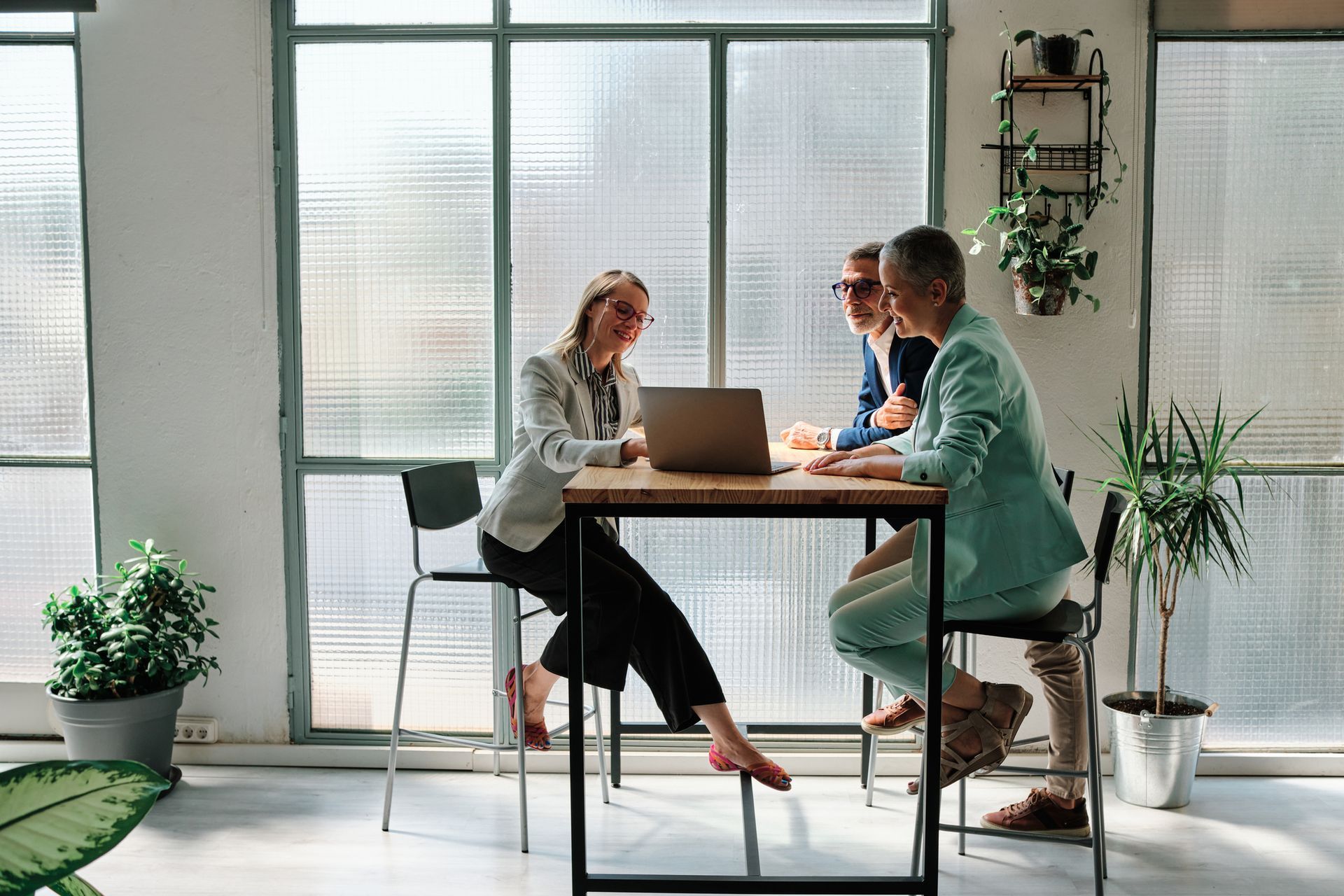 A financial advisor meeting with clients.