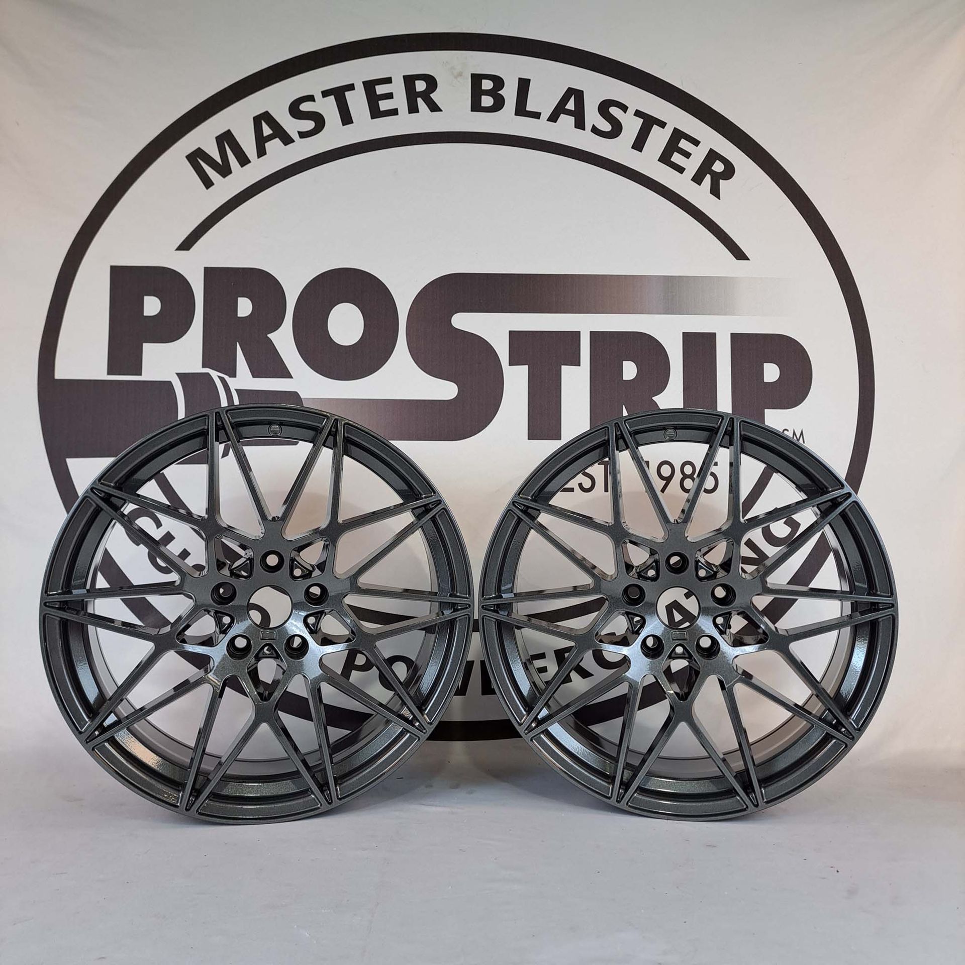A pair of wheels sitting in front of a master blaster prostrip logo