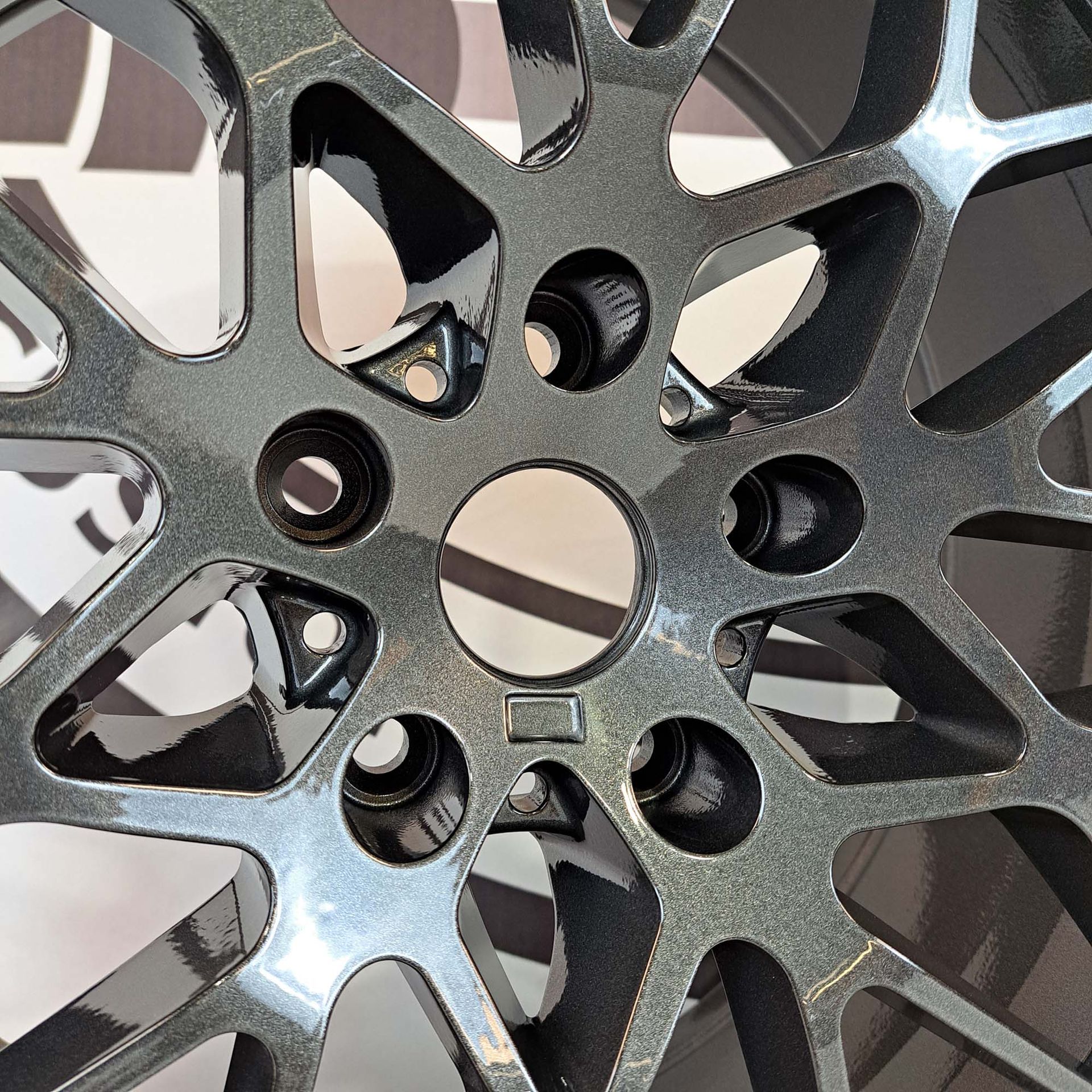 A close up of a wheel with holes in it