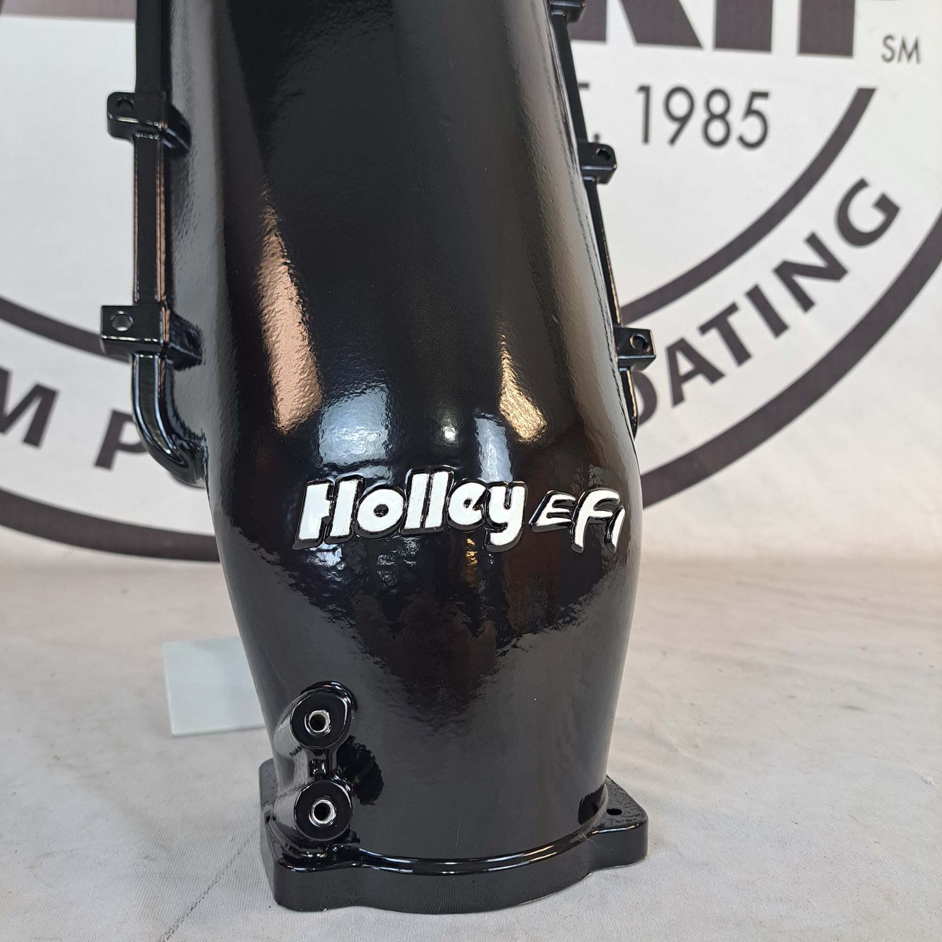 A black object with the word holley on it