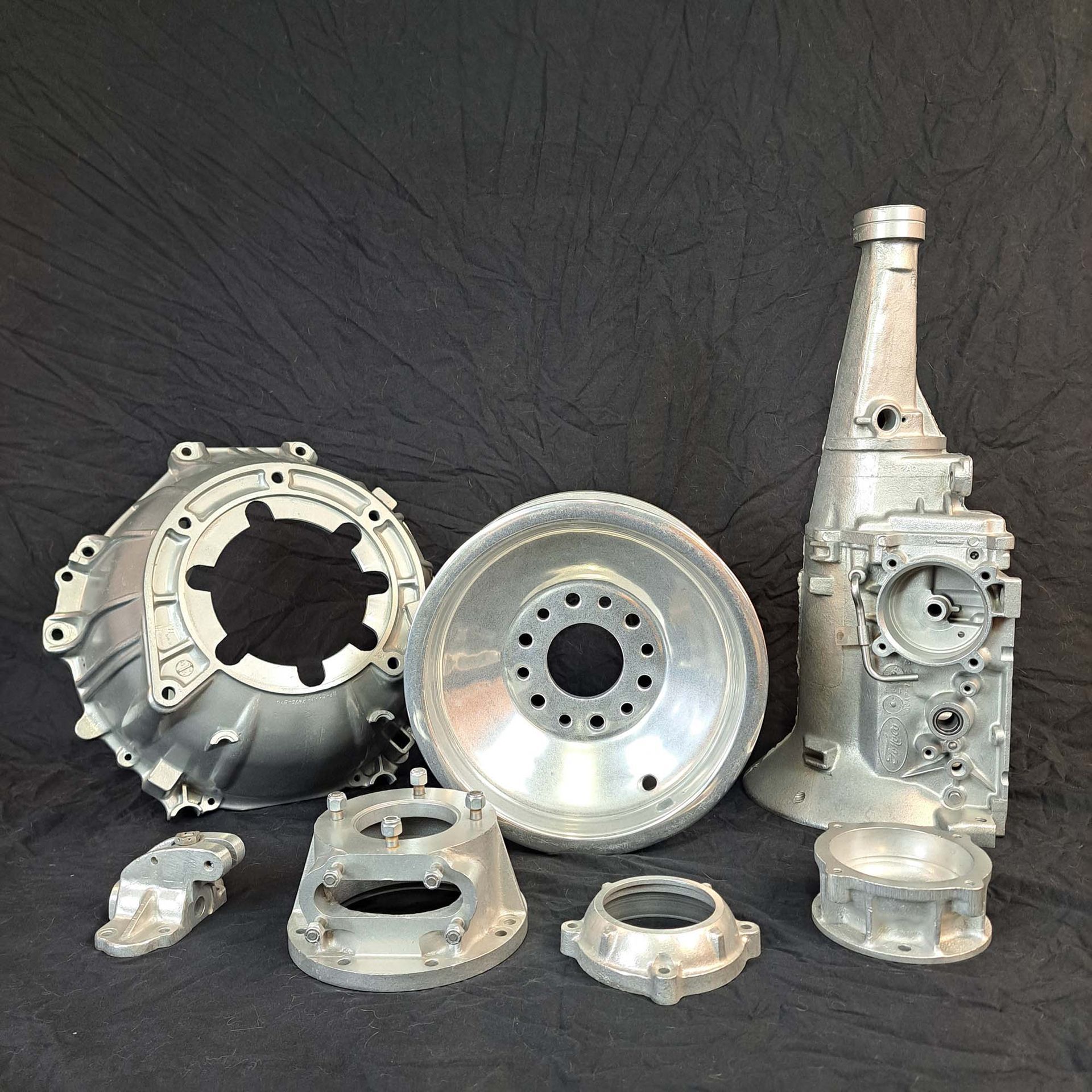 A bunch of metal parts are sitting on a table