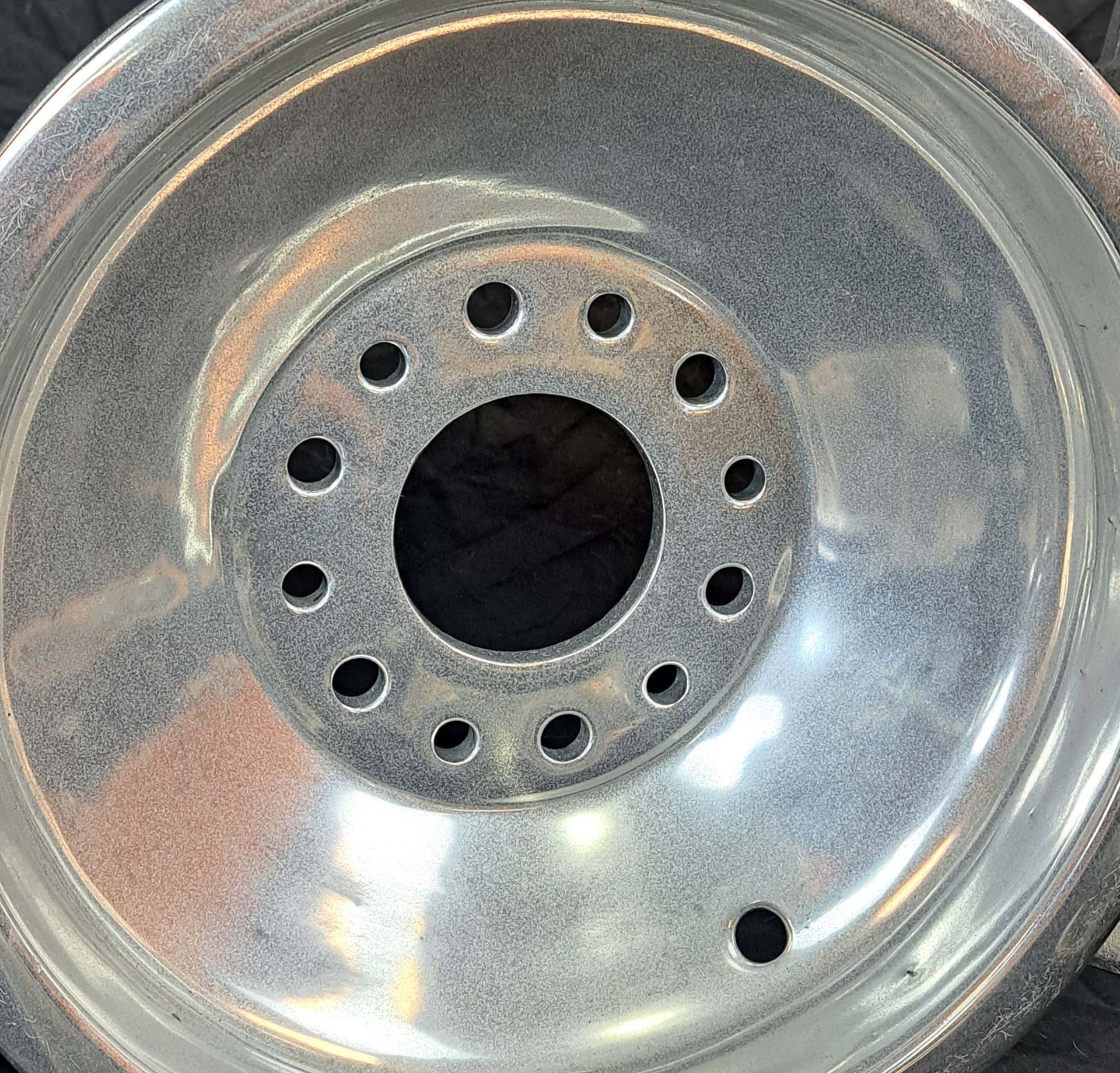 A close up of a wheel with holes in it