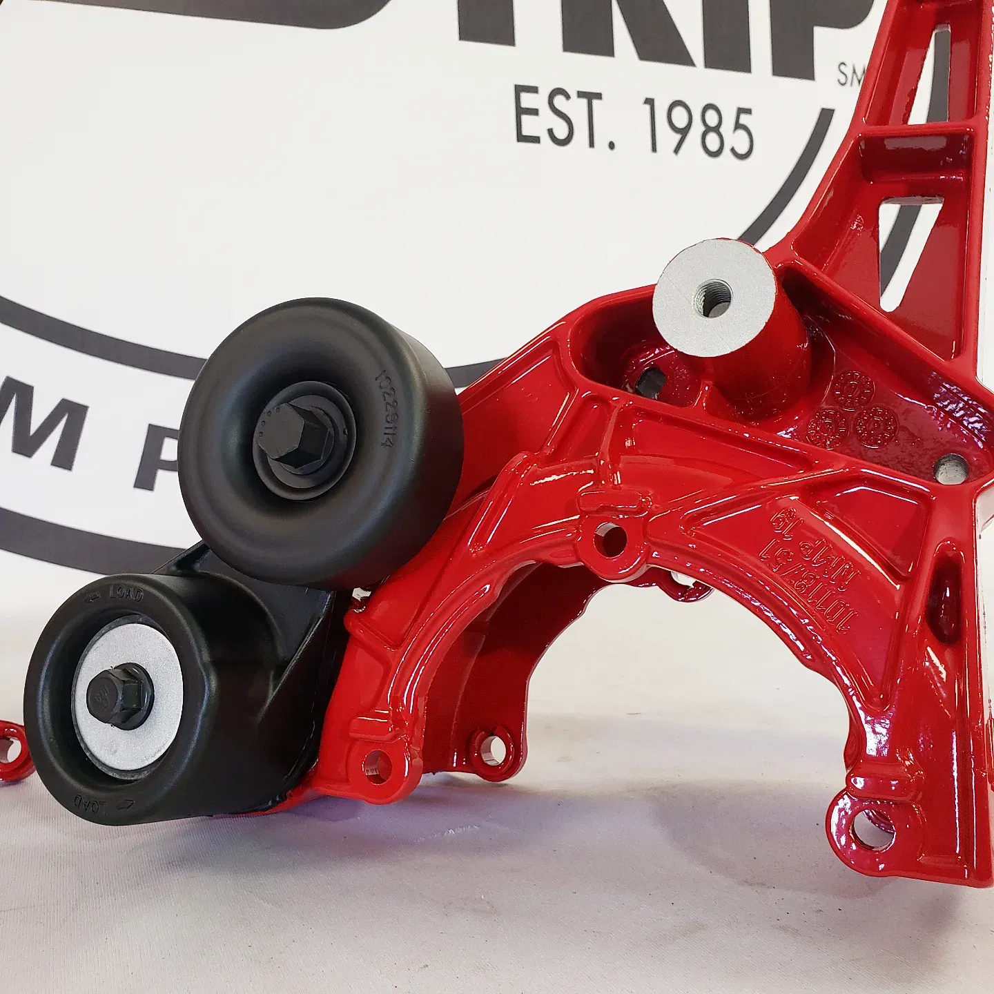 A red and black item with the year 1985 on it