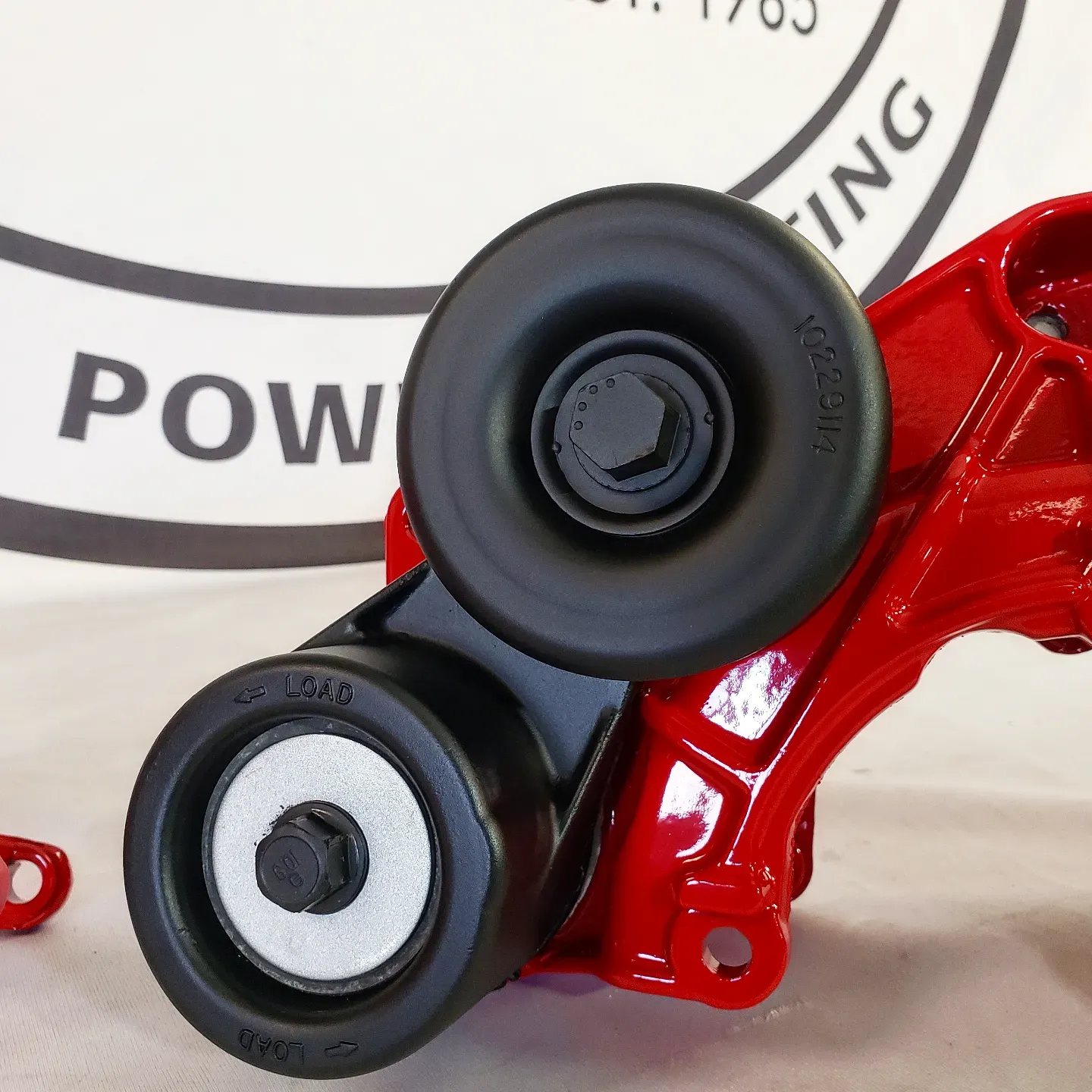 A red item with the word pow on it