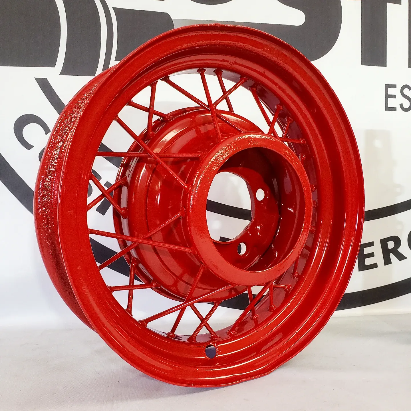 A red wheel sits in front of a sign that says best