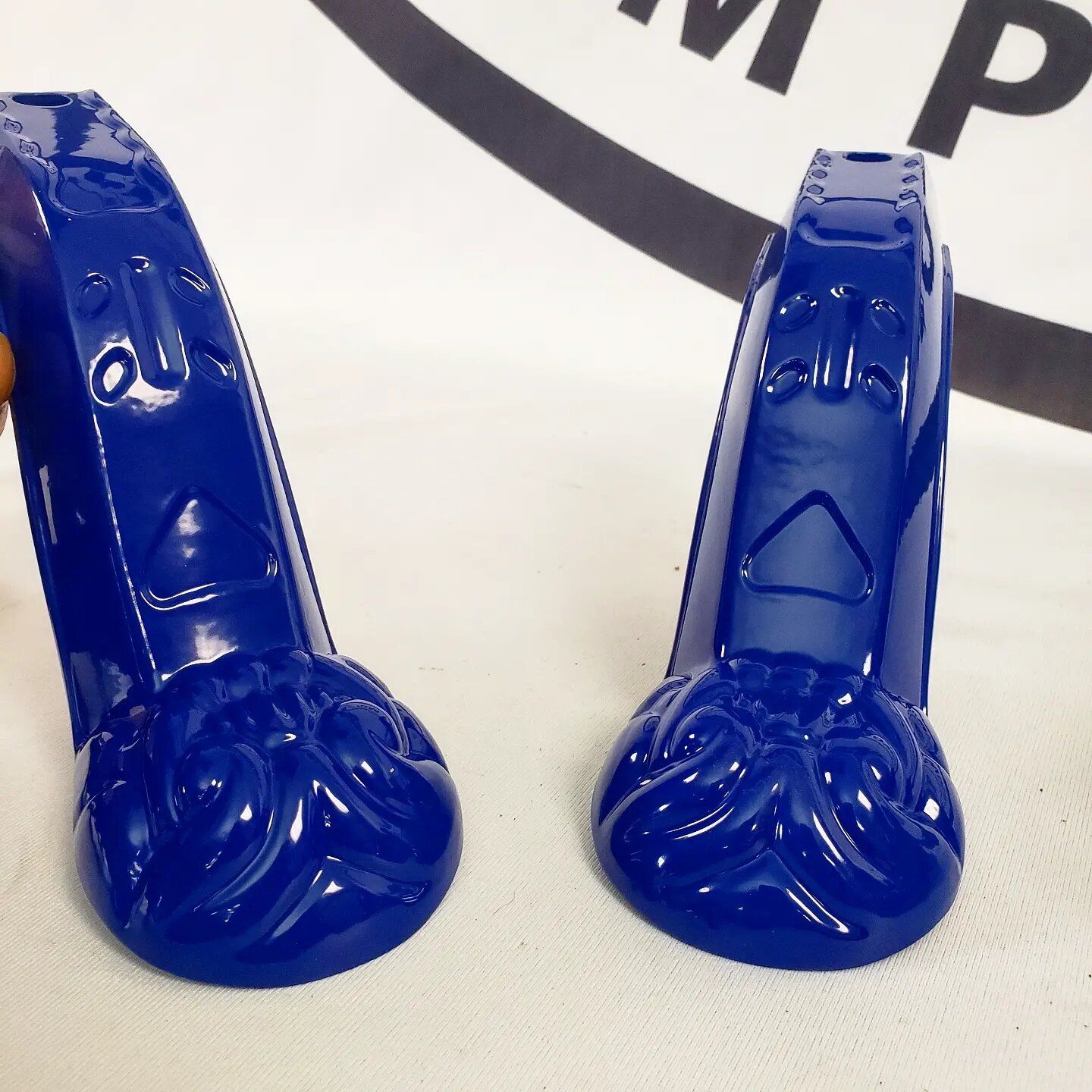 A pair of blue high heels are sitting on a table