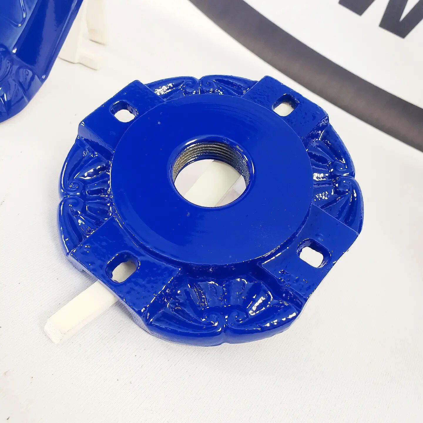 A close up of a blue object with a hole in the middle