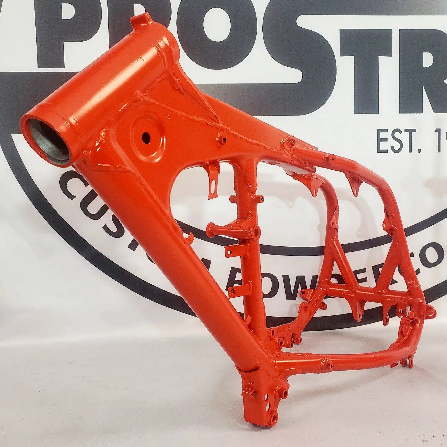Orange Motorcycle Front Frame — Fort Wayne, IN — ProStrip Professional Metal Refinishing, Inc.